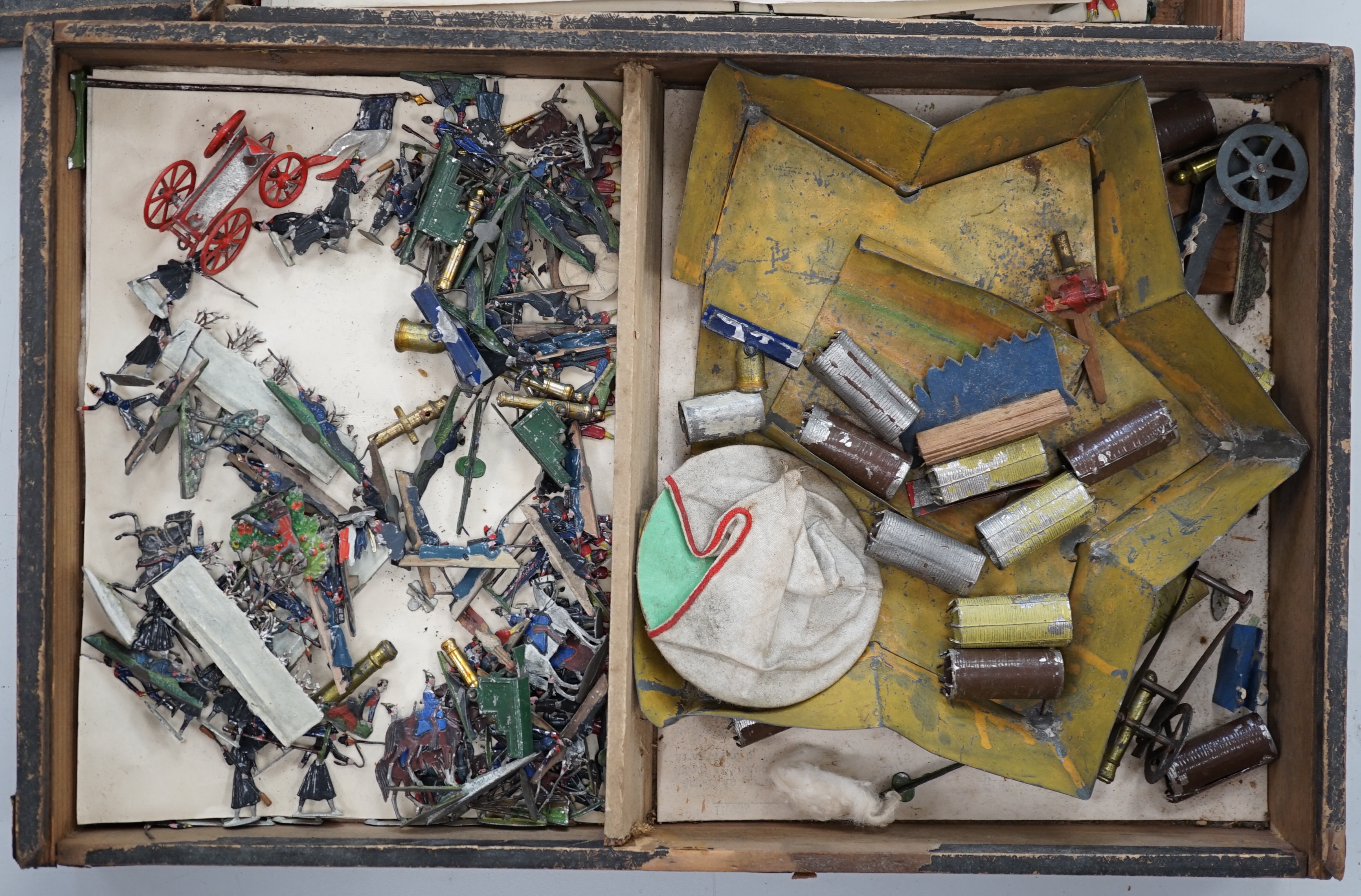 Two late nineteenth century wooden Haffner boxes of flat/semi-flat soldiers, contents believed to be primarily by Haffner; ‘Fight of Paris’ (set no.543) and ‘Battle of Sedan’ (set no.528)